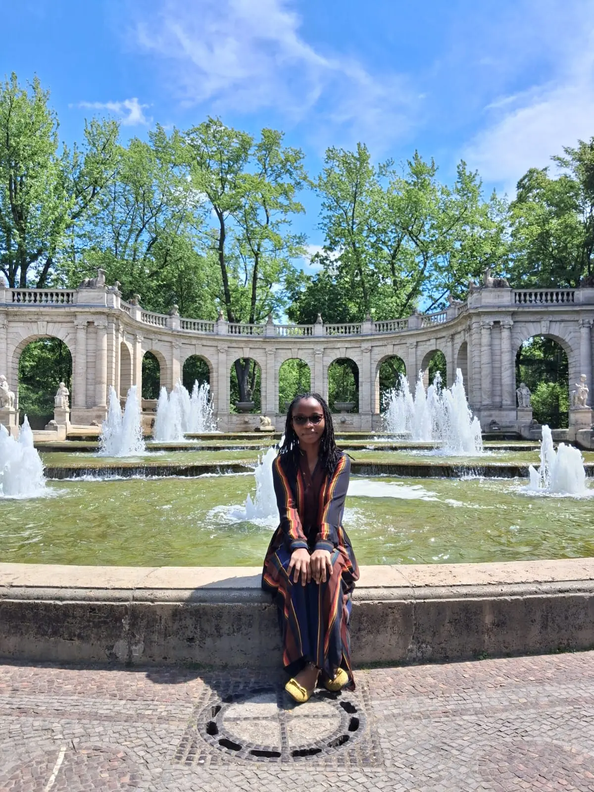 Najma Gael at the Märchenbrunnen fountain in Volkspark Friedrichshain, Berlin
