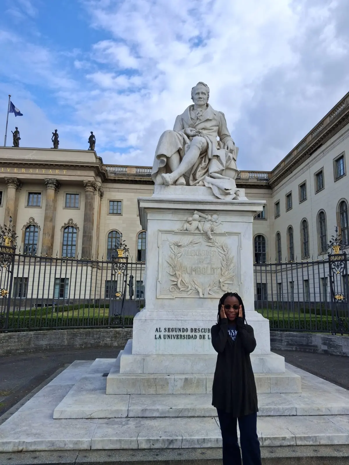 Najma Gael outside Humboldt-Universität zu Berlin, beside the statue of Alexander von Humboldt