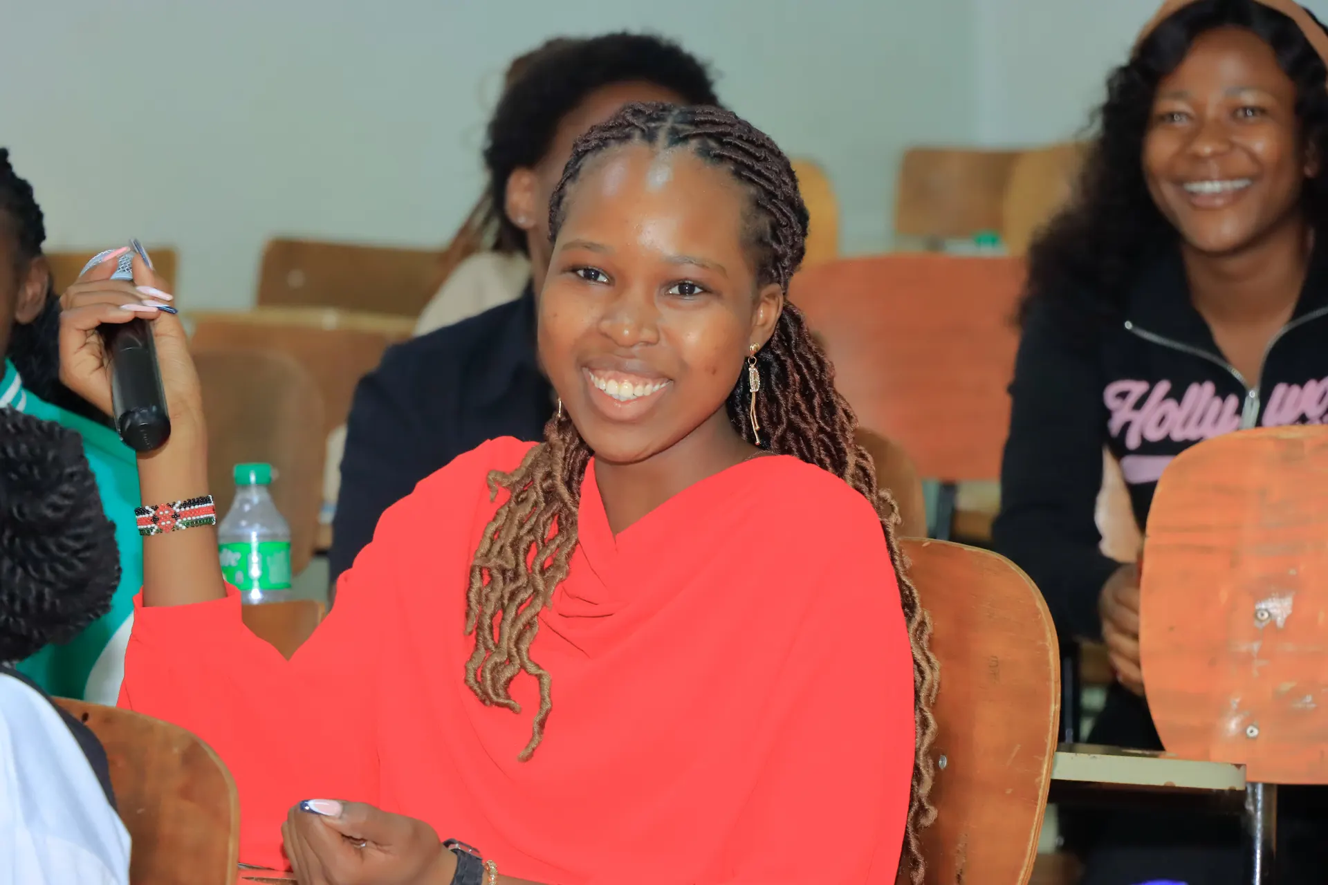 A Kenyan nurse asking a question during a Teamgeist International session on working in Germany.